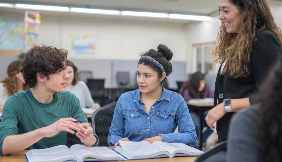 students and instructor with open books