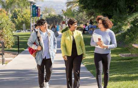 students chatting on campus