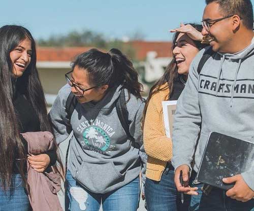 laughing students on campus