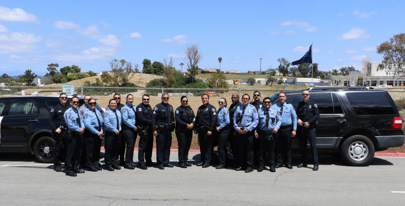 smiling uniformed police officers