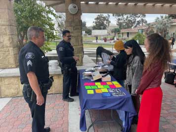 police officers chat with students