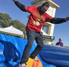 Man jumping on bounce house