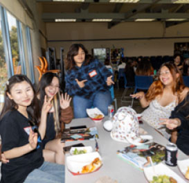 students laughing eating lunch