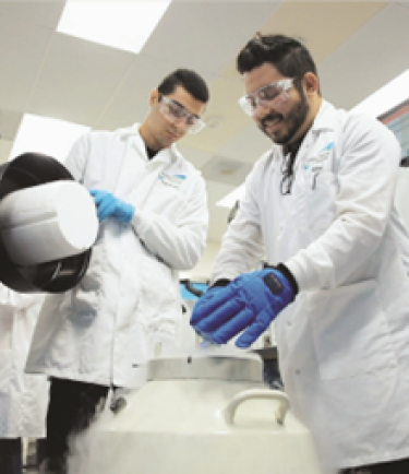 Two men working in white lab coats