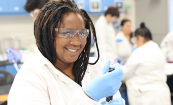 woman working in white lab coat