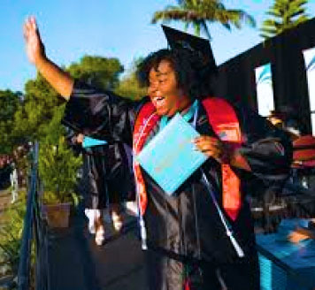Happy female grad with diploma